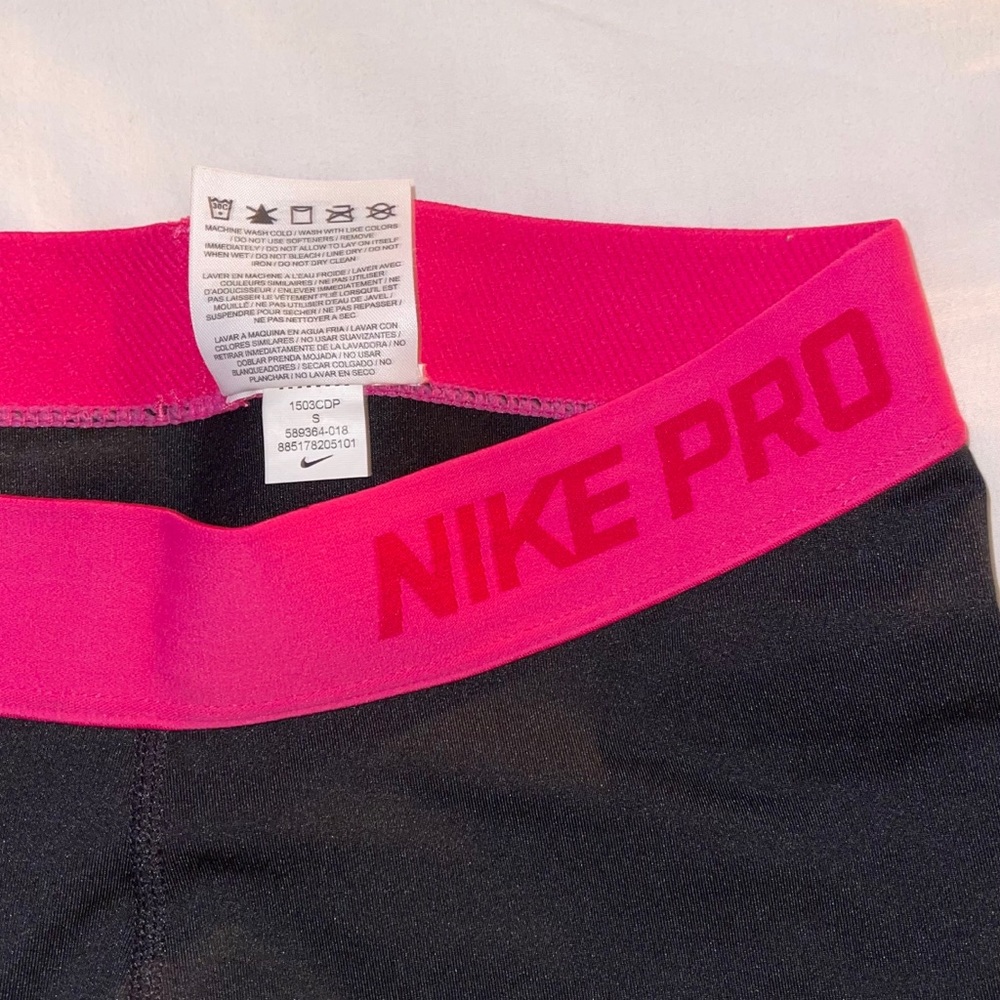 Black and pink Nike pro shorts